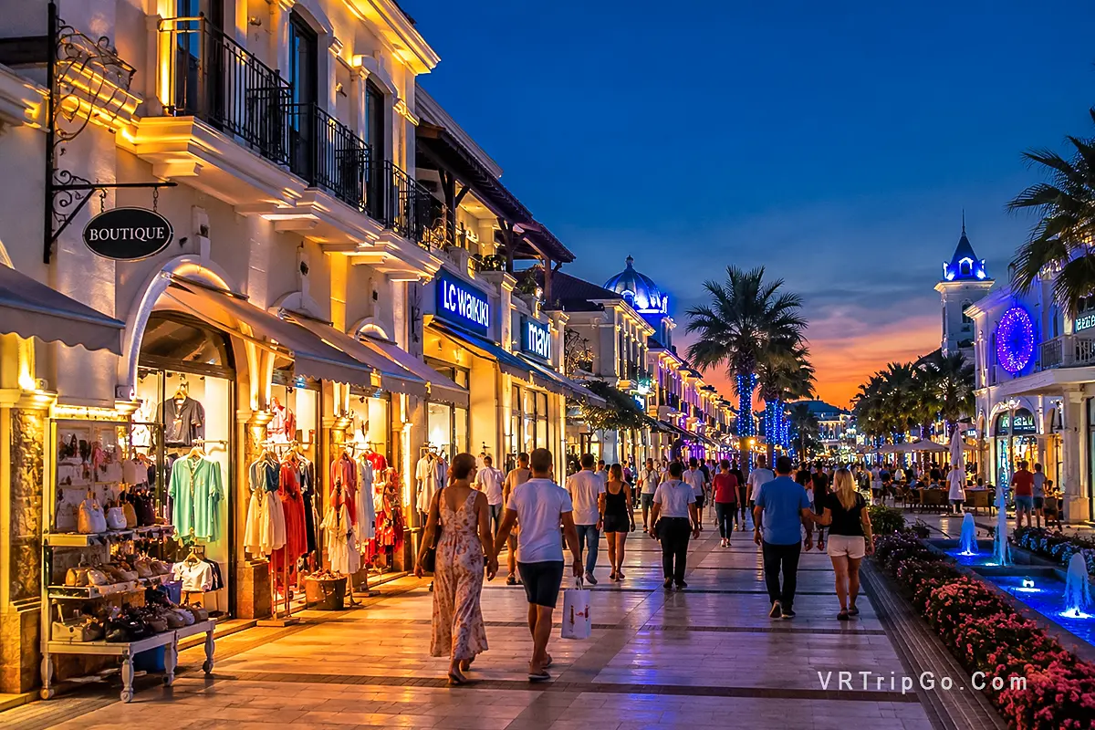 Shopping in Belek luxury shopping street with tourists and evening resort atmosphere in Turkey