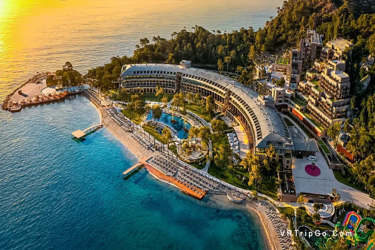 luxury hotels in Kemer aerial sunset resort and turquoise Mediterranean coastline view