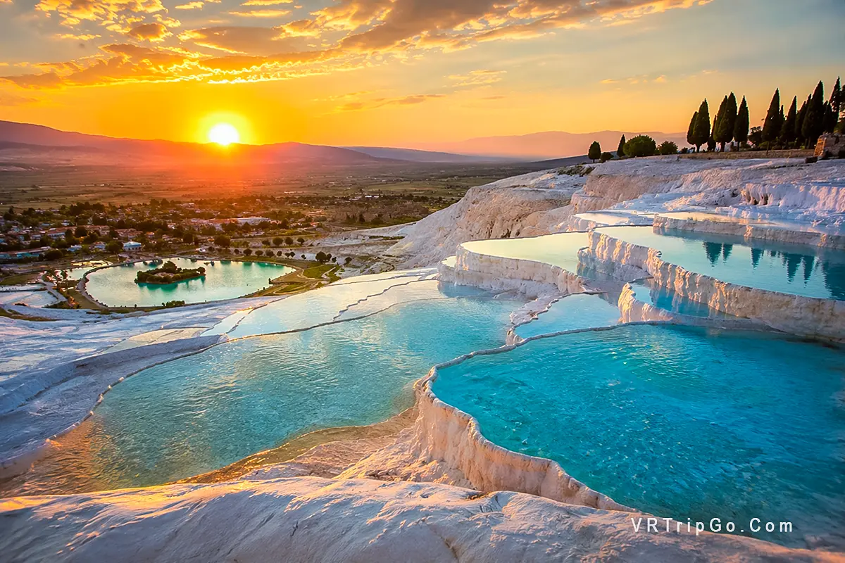 Pamukkale Day Trip from Antalya featuring the famous white travertine terraces, turquoise thermal pools, and breathtaking sunset views over the valley landscape