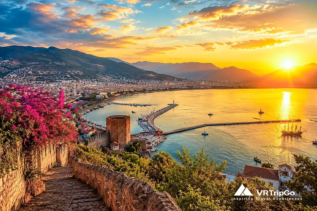 Best time for excursions in Alanya with sunset coastal view, mountains and harbor panorama, perfect weather for sightseeing and outdoor activities in Alanya Turkey