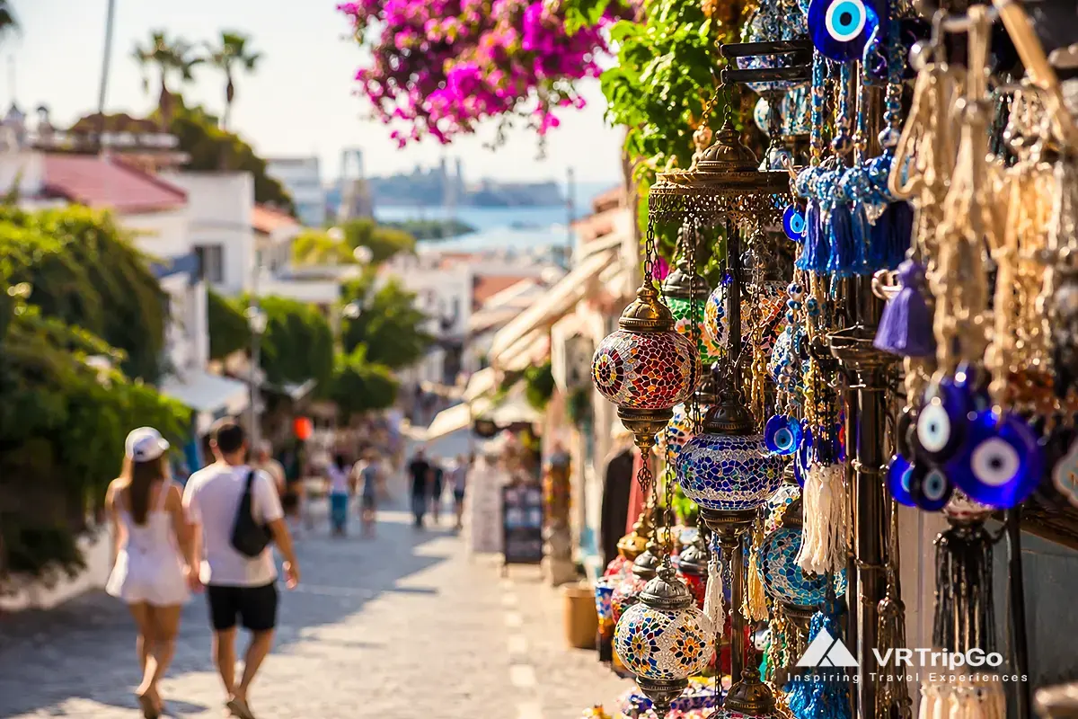 Kusadasi Travel Guide market street with traditional Turkish lanterns and local souvenir shops near the Aegean coast in Turkey