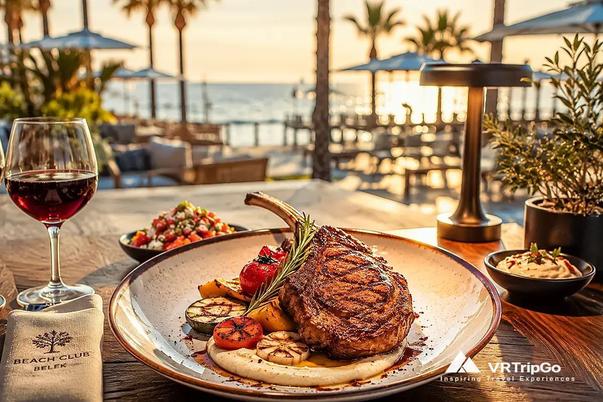 Traditional Turkish food in Belek served at a luxury beach club restaurant with grilled steak, Mediterranean appetizers, and sunset sea view