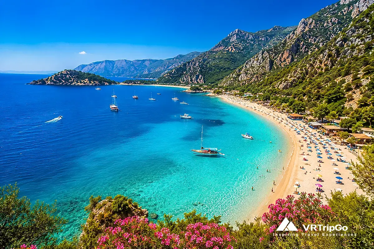 Best beaches in Oludeniz with crystal-clear turquoise sea, scenic Mediterranean coastline, luxury beach atmosphere and mountain views near the Blue Lagoon.