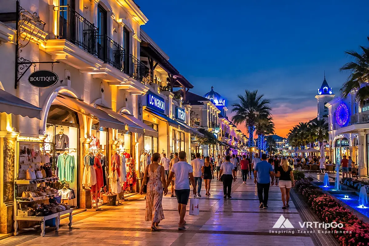 Shopping in Belek luxury shopping street with tourists and evening resort atmosphere in Turkey