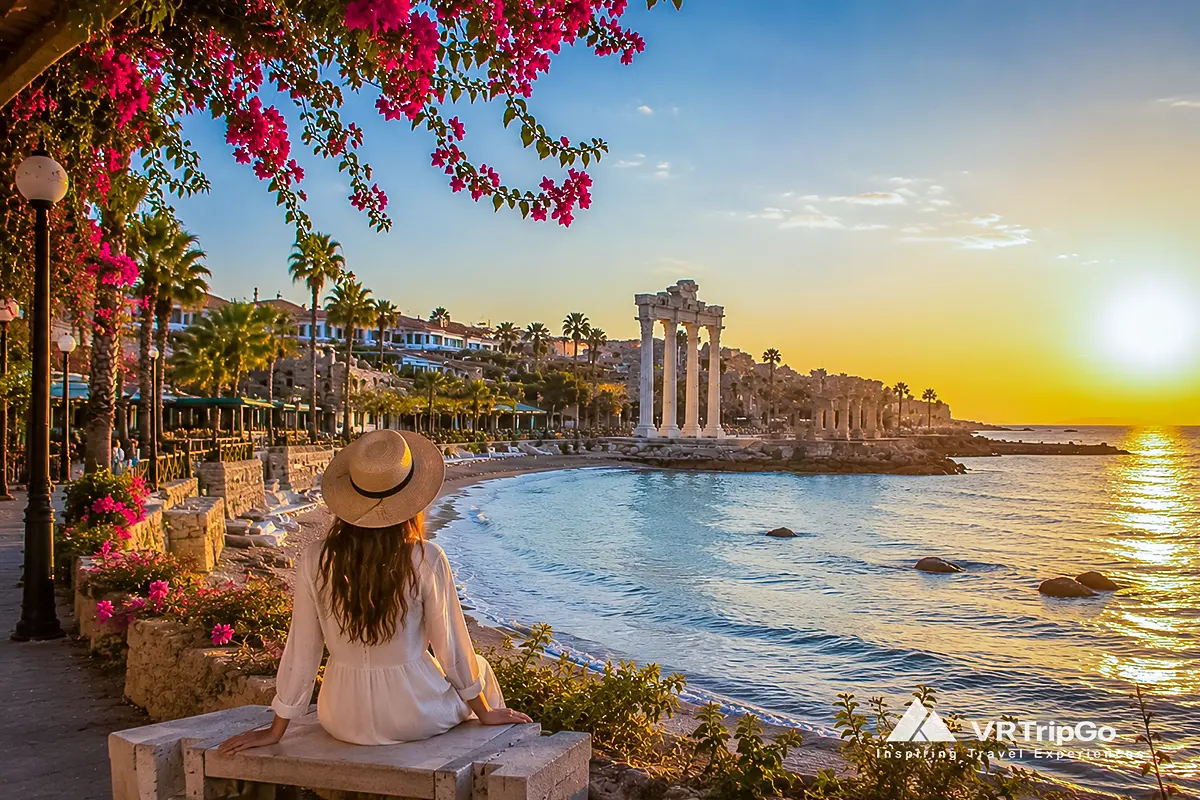 Best Month to Visit Side: Woman Enjoying a Golden Sunset View of the Mediterranean Coast and the Temple of Apollo in Side, Turkey