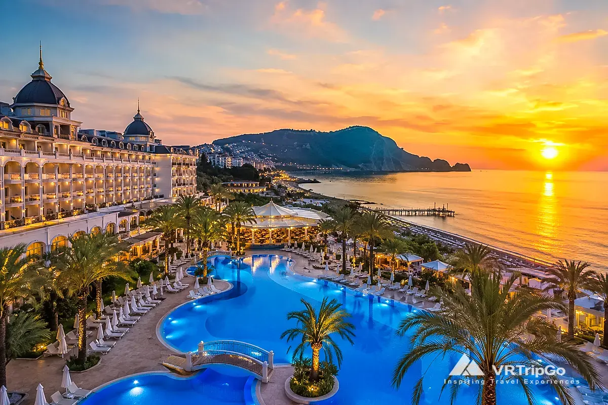 Best hotels in Alanya with luxury beachfront resort, swimming pool, palm trees and sunset sea view, top accommodation in Alanya Turkey