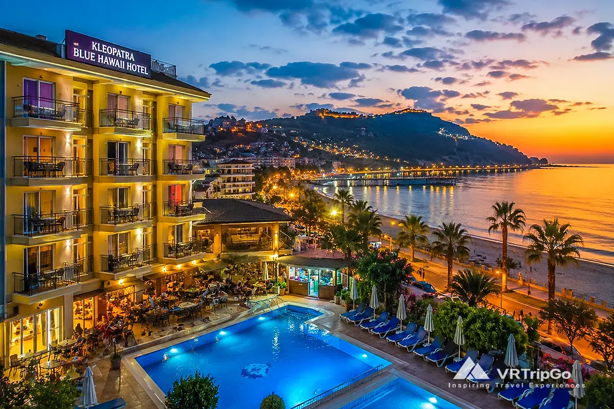 Cheap hotels in Alanya near beach with pool and city view at sunset, affordable accommodation options in Alanya Turkey