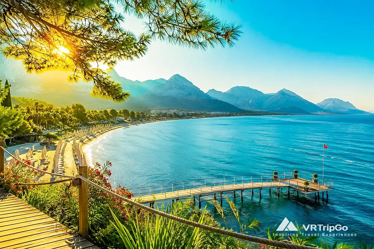 Best Time to Visit Kemer beach view with turquoise sea and mountains at sunset