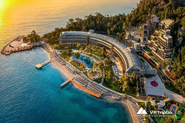 luxury hotels in Kemer aerial sunset resort and turquoise Mediterranean coastline view