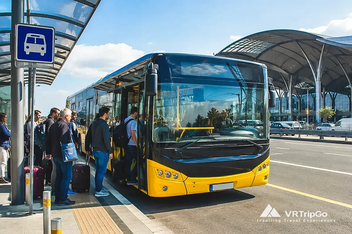 Budget Option: Bus from the Airport to Istanbul with sunny airport terminal and travelers with luggage