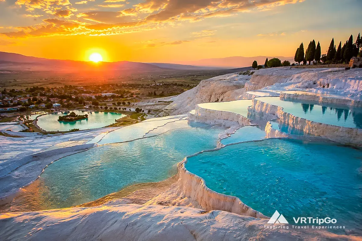 Pamukkale Day Trip from Antalya featuring the famous white travertine terraces, turquoise thermal pools, and breathtaking sunset views over the valley landscape