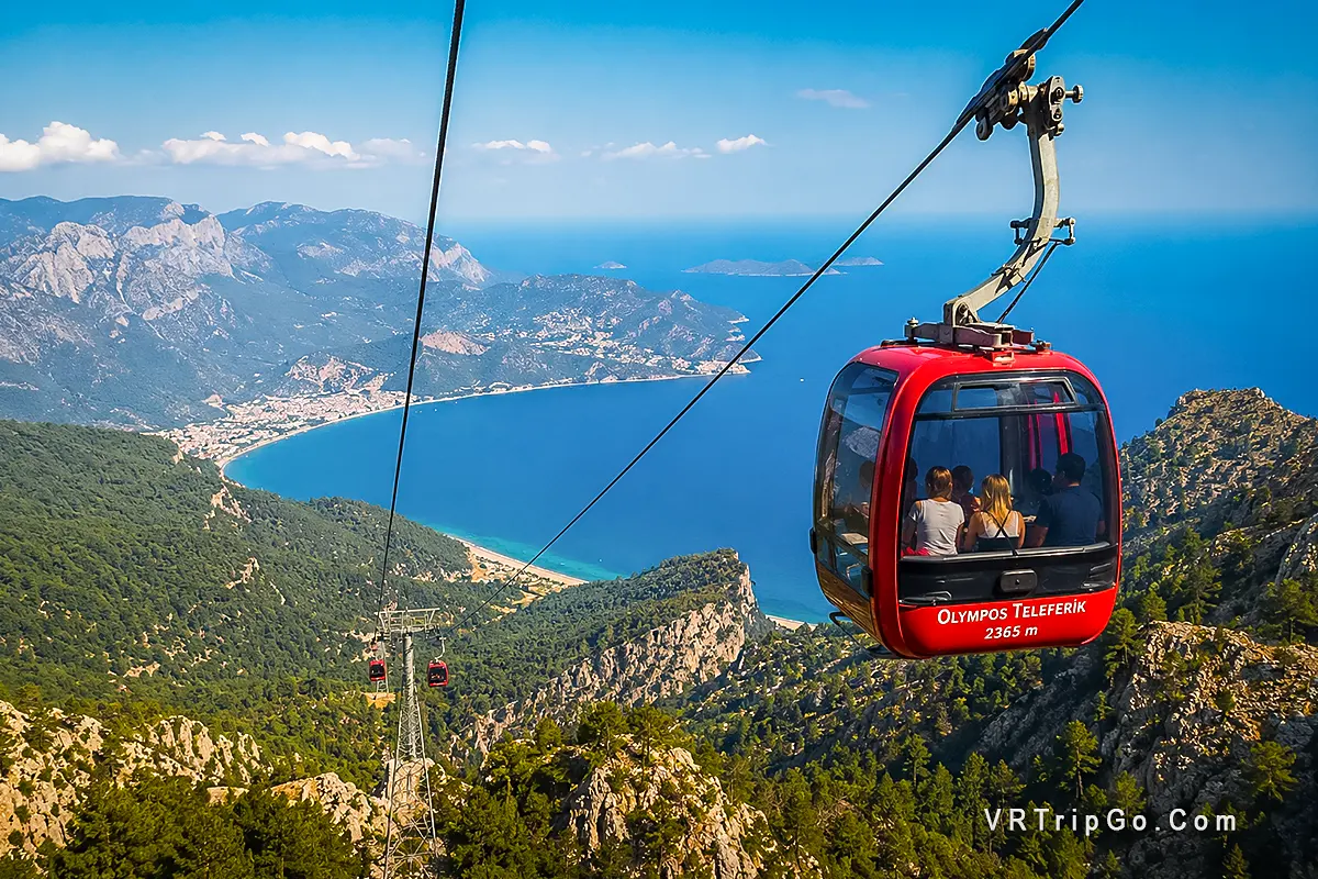 Olympos Cable Car Experience featuring the Olympos Teleferik cable car, breathtaking views from Mount Tahtali, dramatic Taurus Mountains, and stunning Mediterranean coastline scenery near Kemer.
