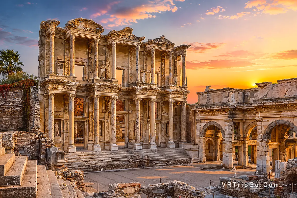Ephesus Tour from Bodrum featuring the Library of Celsus and ancient Roman ruins at sunset in Ephesus.