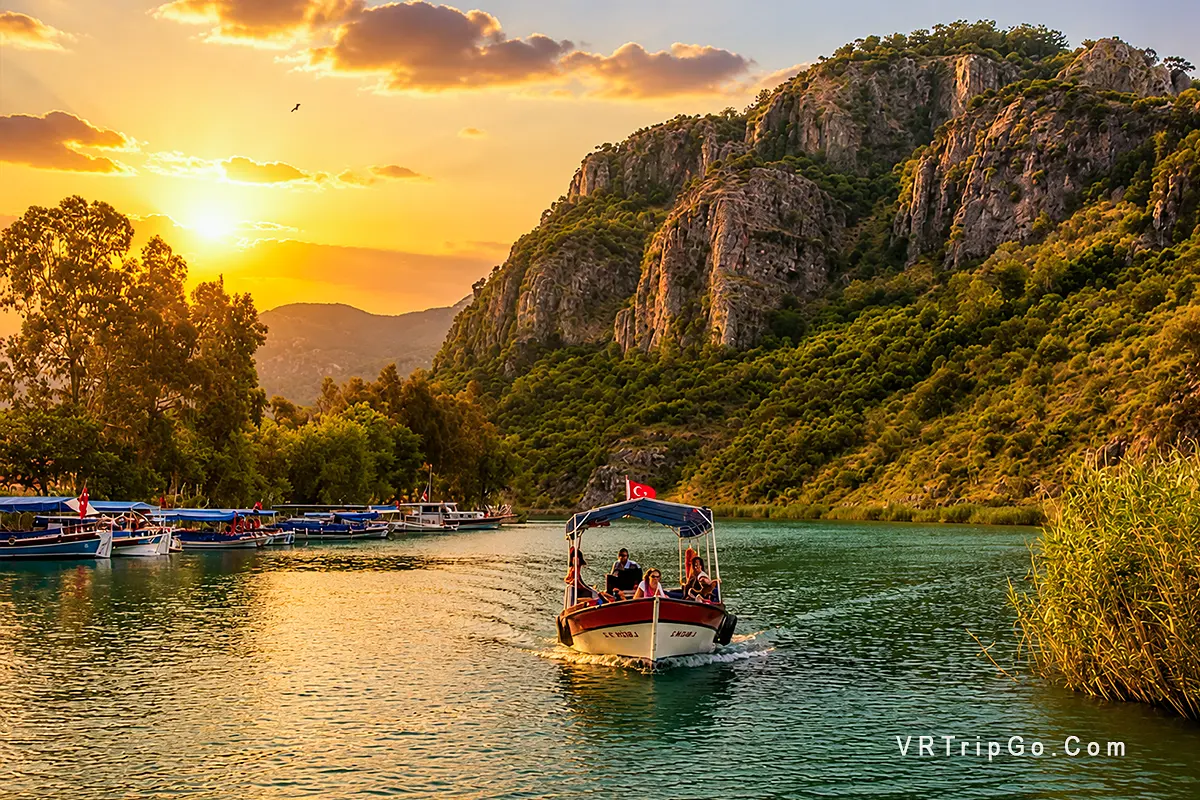 Dalyan Tour and Turtle Beach featuring a scenic river cruise through lush landscapes, dramatic cliffs, and beautiful sunset views