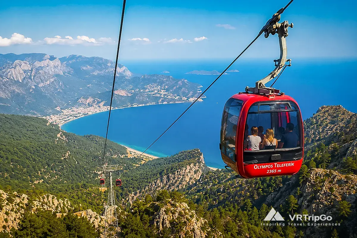 Olympos Cable Car Experience featuring the Olympos Teleferik cable car, breathtaking views from Mount Tahtali, dramatic Taurus Mountains, and stunning Mediterranean coastline scenery near Kemer.
