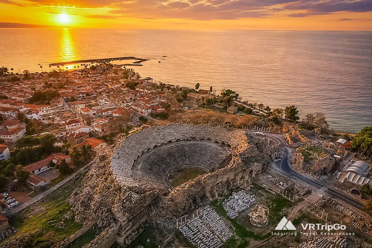 Side City Tour featuring the ancient Roman theatre, historic ruins, and stunning Mediterranean coastline at sunset.