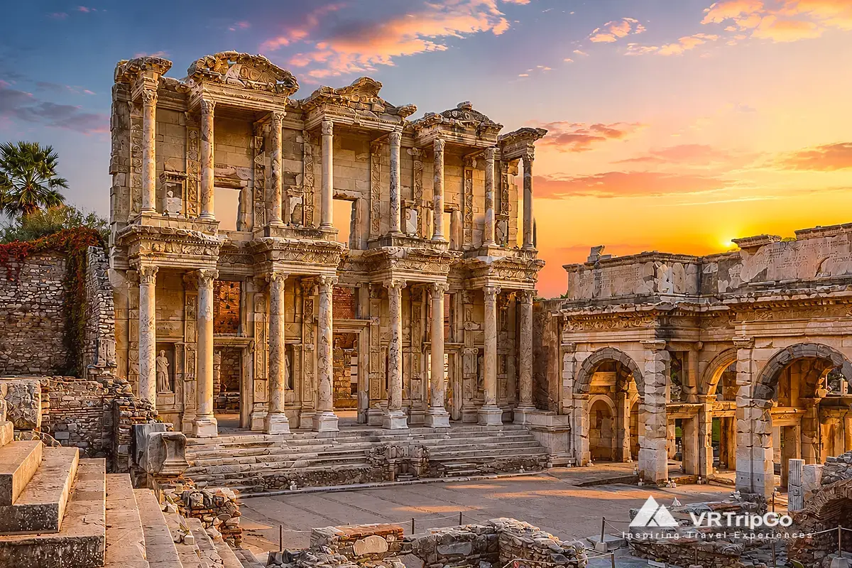 Ephesus Tour from Bodrum featuring the Library of Celsus and ancient Roman ruins at sunset in Ephesus.