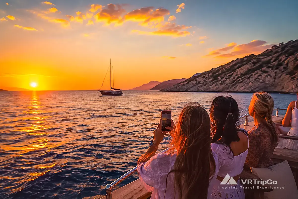 Sunset Boat Trip with Guests Enjoying a Golden Mediterranean Sunset at Sea