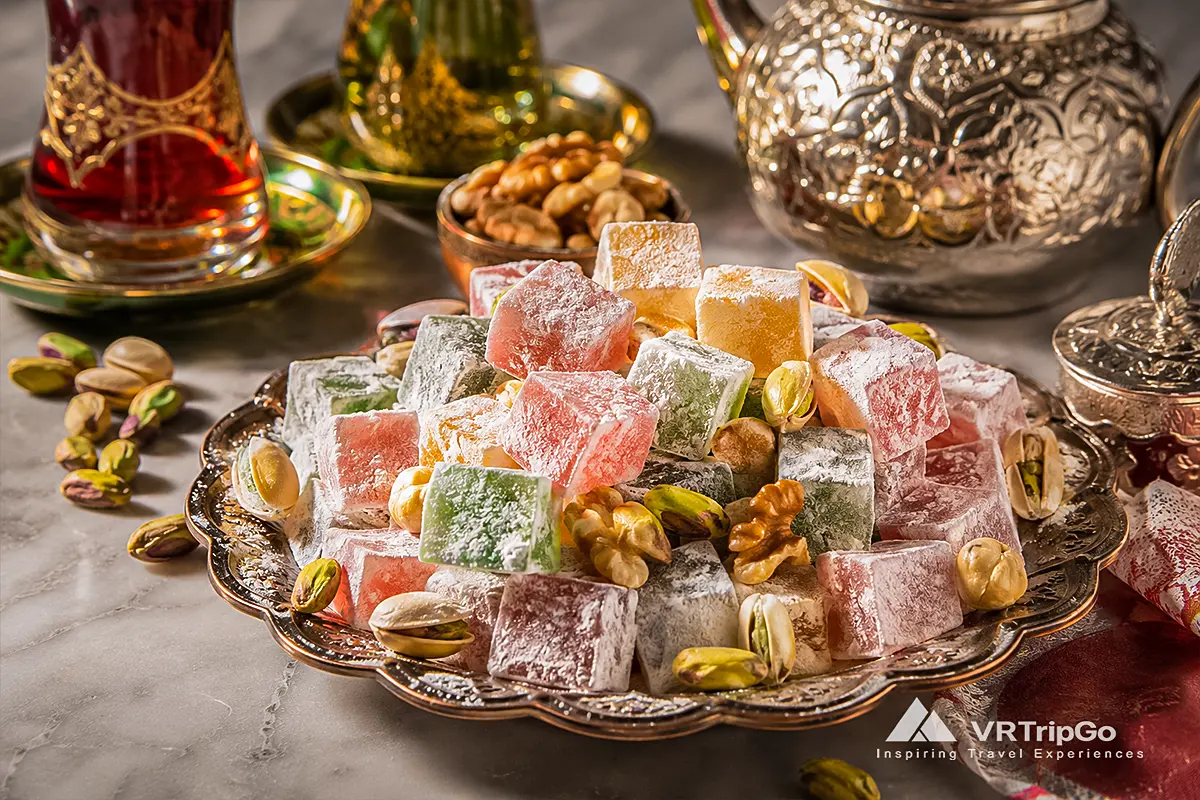 Turkish Delight from Alanya with traditional colorful sweets, pistachios, walnuts, Turkish tea, and authentic local delicacies