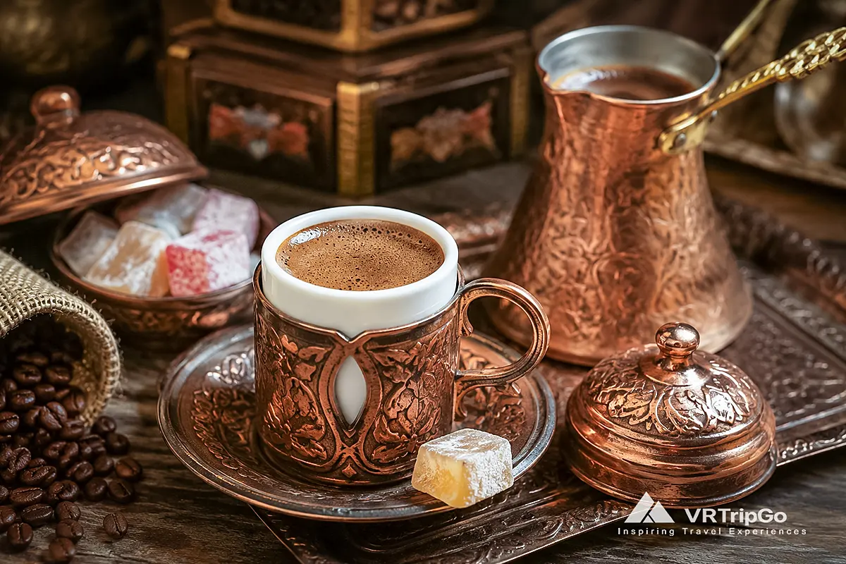 Turkish Coffee from Alanya served in a traditional copper cup with rich coffee foam, roasted coffee beans, Turkish delight, and authentic Ottoman-style coffee culture