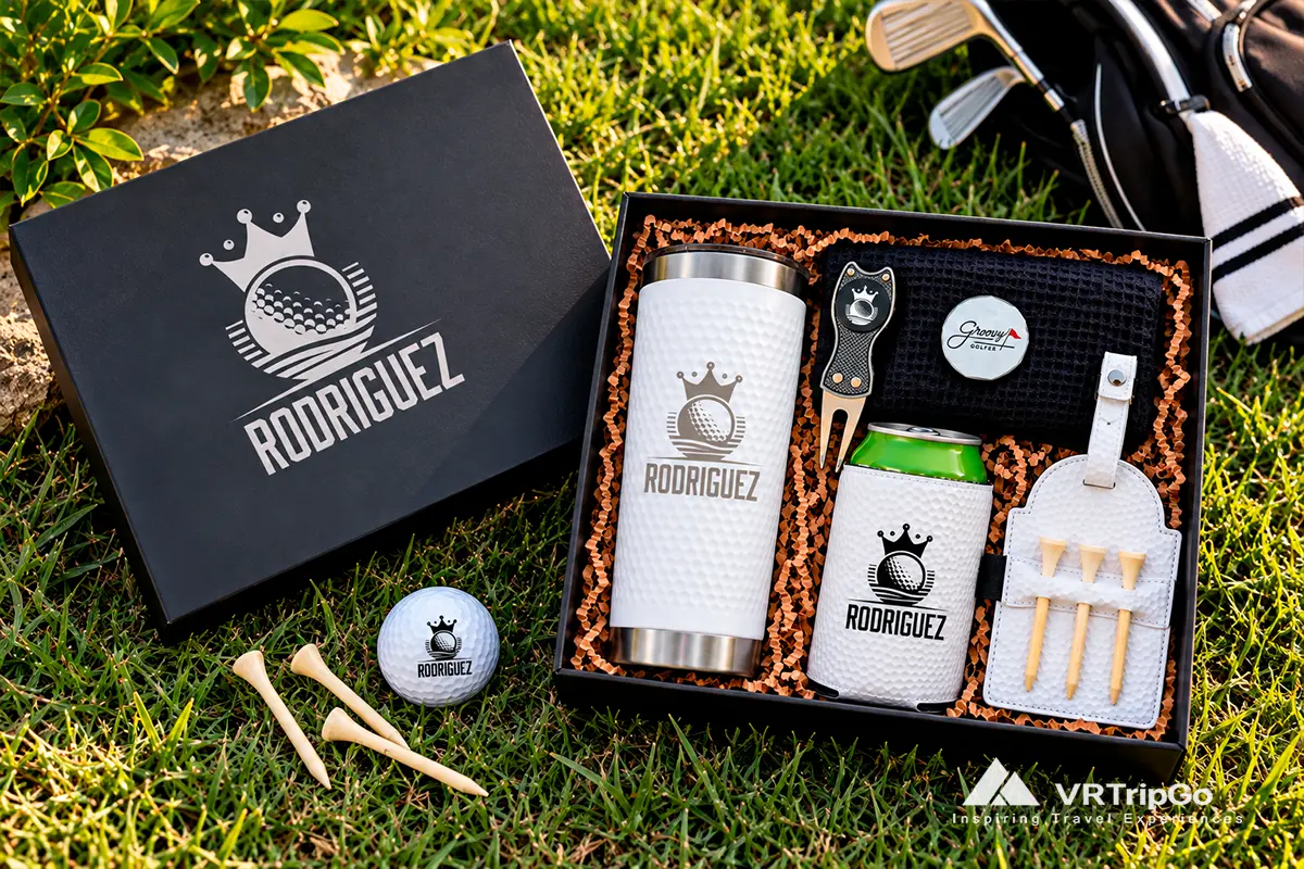 Premium personalized Rodriguez golf gift set with insulated tumbler, can cooler, golf towel, divot tool, tee holder, and golf accessories in an elegant black gift box.